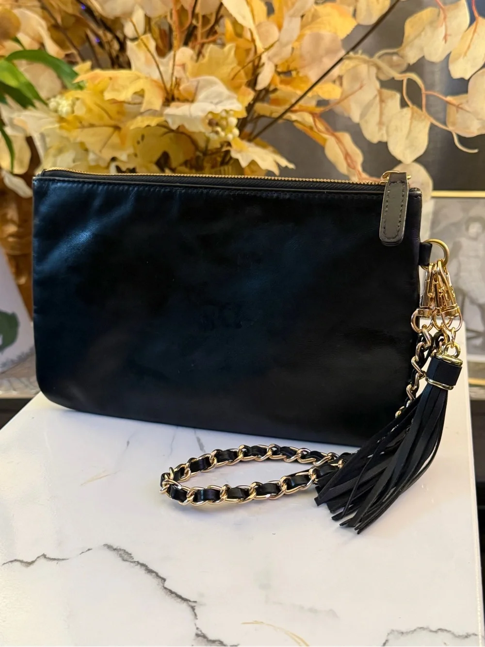 CHANEL Black Leather Clutch with Gold Chain and Tassel